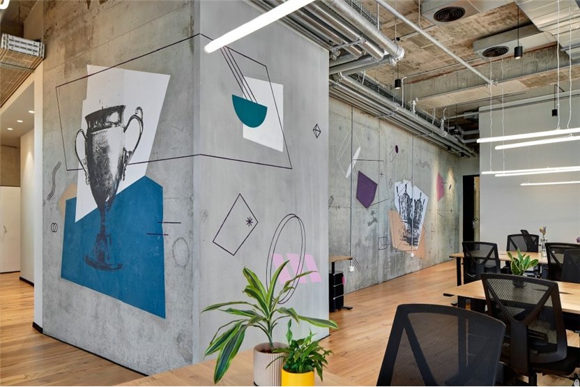 The column piece — a trophy engraving cut against blue and bone planes, wrapping the corner.